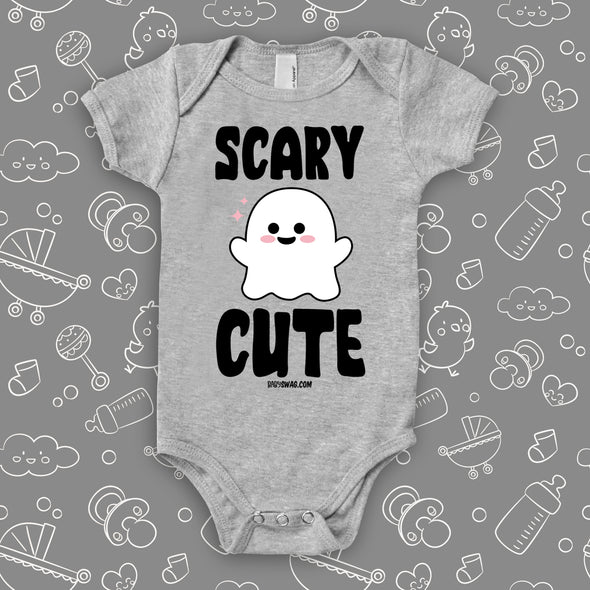 Baby girl onesies with saying "Scary Cute" in grey. 