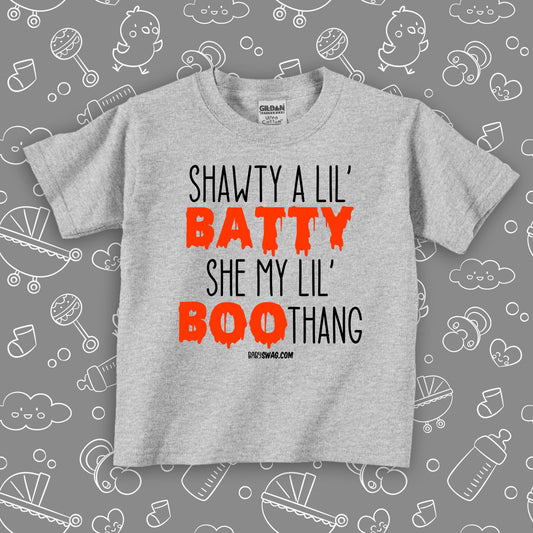 Toddler shirt with saying "Shawty A Lil' Batty, She My Lil" Boo-thang" in grey.  