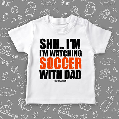 Toddler boy shirts with the caption "Shh...I'm Watching Soccer With Dad" in white. 