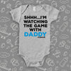 Cool toddler cllothes with saying "Shh...I'm Watching The Game With Dad" in grey. 