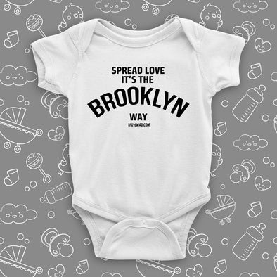 Cool baby onesies with saying "Spread Love, It's The Brooklyn Way" in white. 