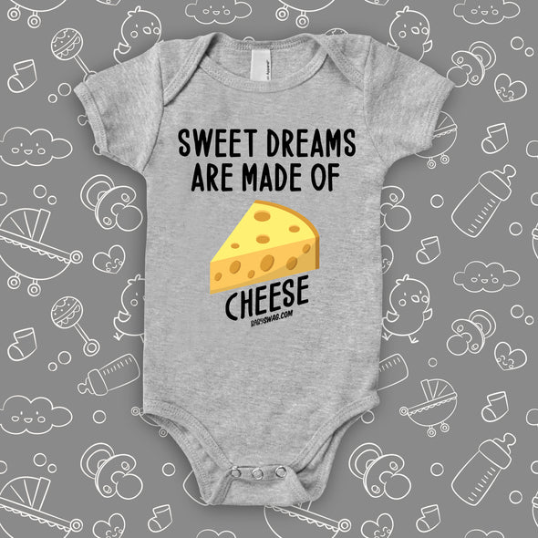 Grey baby onesie with print: "Sweet dreams are made of" and an image of cheese.