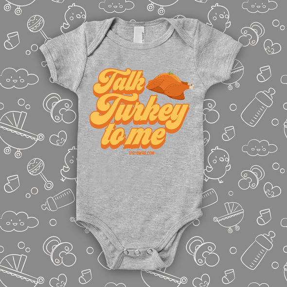 Hillarious baby onesies with saying "Talk Turkey To Me" in grey.