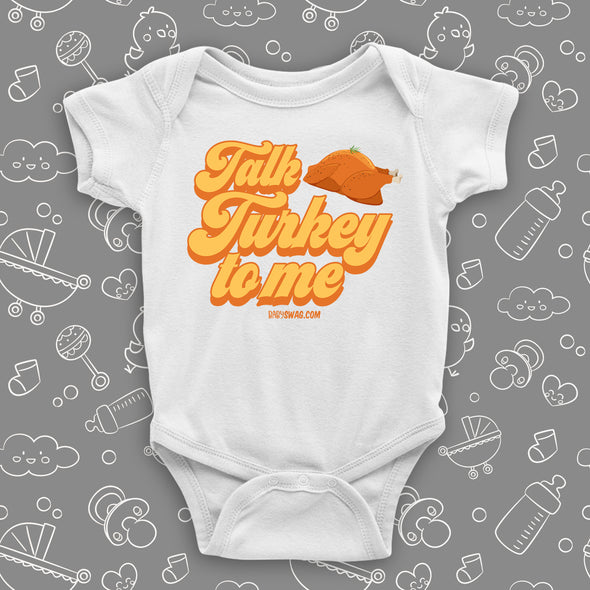 Hillarious baby onesies with saying "Talk Turkey To Me" in white. 
