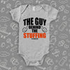 Funny baby onesies with saying "The Guy Behind The Stuffing" in grey. 