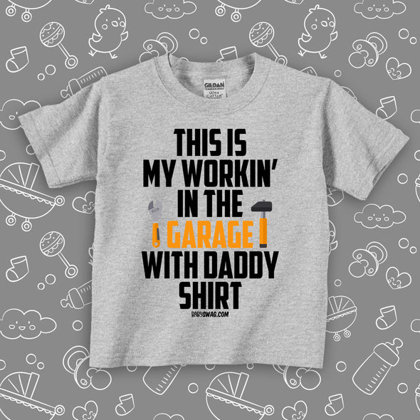 Toddler boy shirt with saying "This Is My Workin' In The Garage With Daddy Shirt" in grey.  