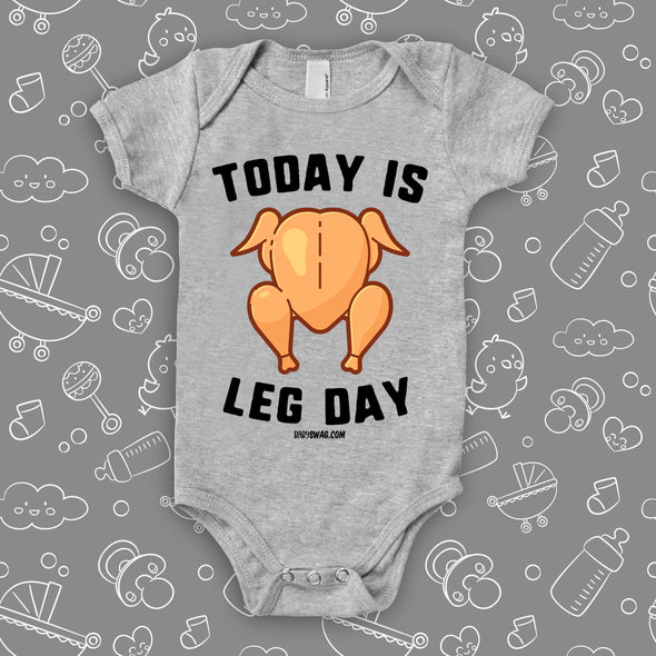 Hilarious baby onesies with saying "Today Is Leg Day" and an image of roasted turkey in grey. 