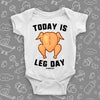 Hilarious baby onesies with saying "Today Is Leg Day" and an image of roasted turkey in white. 
