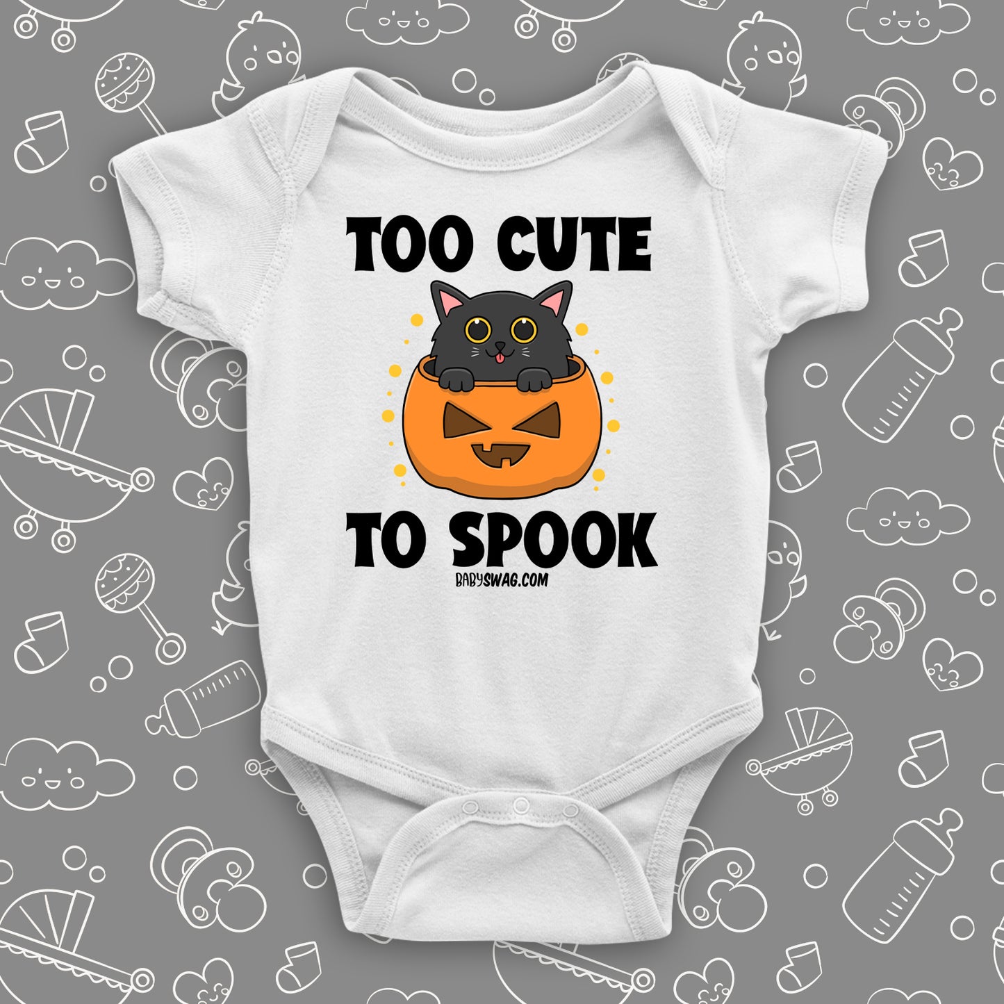 White cute baby onesie saying "Too Cute To Spook" with an image of a kitten coming out of the Halloween pumpkin.