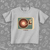 The "Vinyl Turntable" toddler graphic tees in grey. 