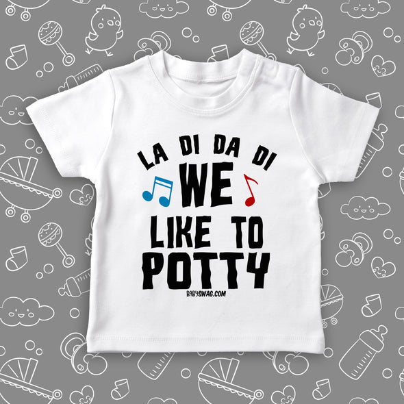 Cute toddler shirt with saying "We Like To Potty" in white.