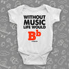 Cute baby onesies with saying "Without Music, Life Would Be Flat" in white.