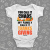 Funny baby onesie with saying "You Call Iy Chaos, My Family Calls It Thanksgiving" in white.