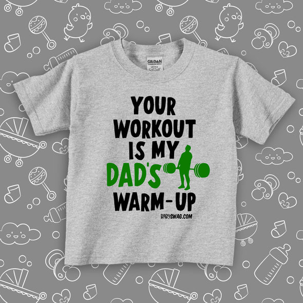 Toddler graphic tee with saying "Your Workout Is My Dad's Warm-up" in grey. 